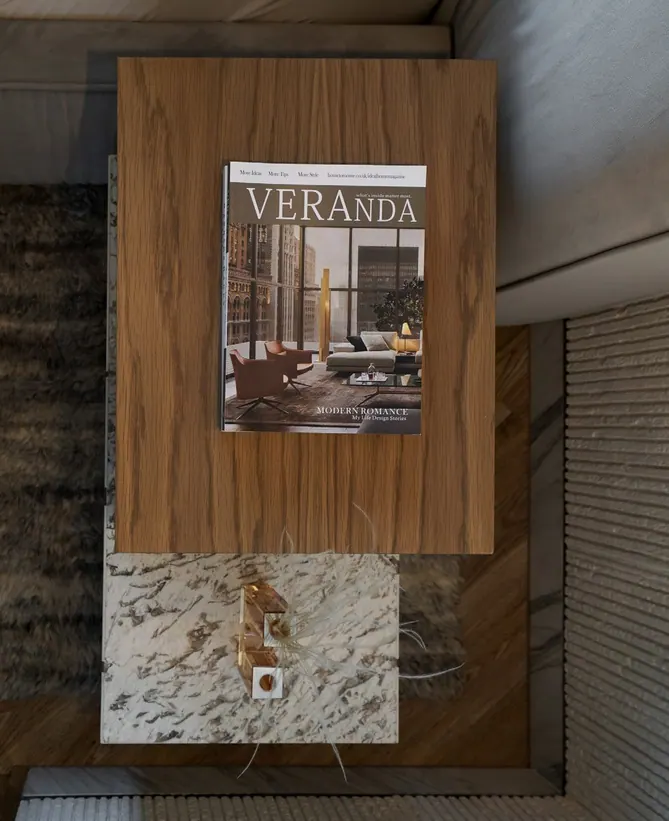 Top view of a bedside table: walnut box on a veined marble block